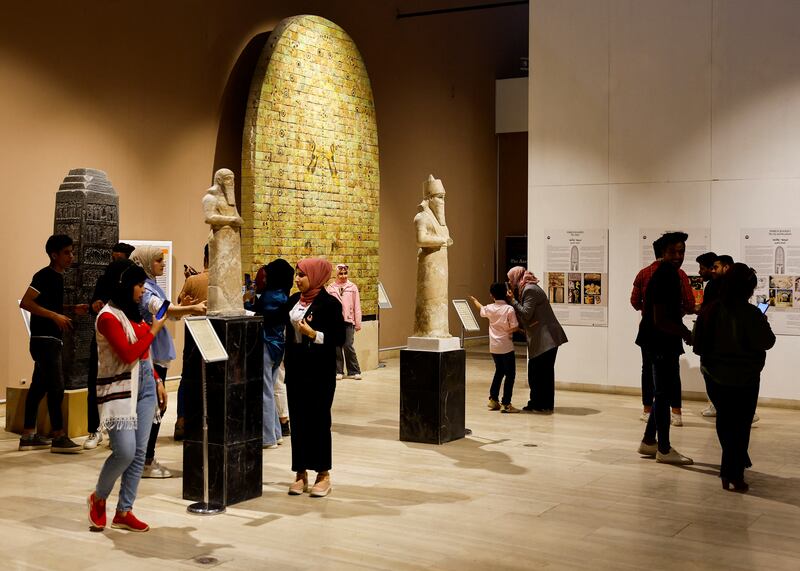 Visitors tour Iraq's National museum in Baghdad. It has reopened to the public after a three-year closure due to the spread of Covid-19 and local unrest. 