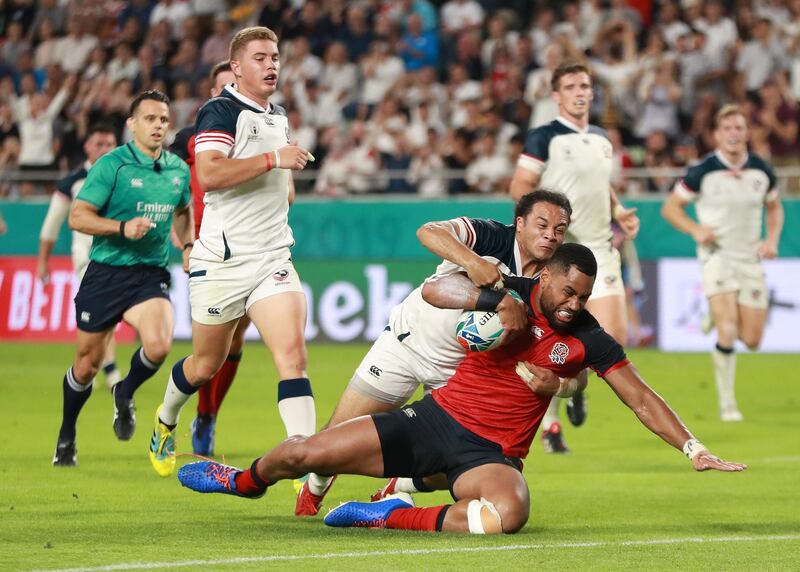 Joe Cokanasiga of England scores his team's seventh try in Kobe. Getty