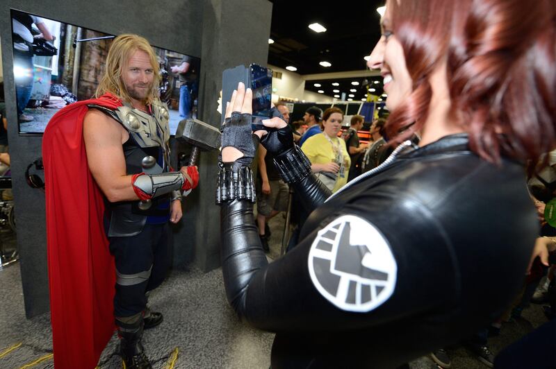 IMAGE DISTRIBUTED FOR LG - An attendee dressed as Black Widow uses the LG Optimus G Pro to take picture of Thor at the Legendary Entertainment booth at Comic-Con International 2013, on Saturday, July, 20, 2013 in San Diego, Calif. (Photo by Jeff Bottari/Invision for LG/AP Images) *** Local Caption ***  LG Electronics USA and Legendary Entertainment team up at Comic-.JPEG-0fe8f.jpg