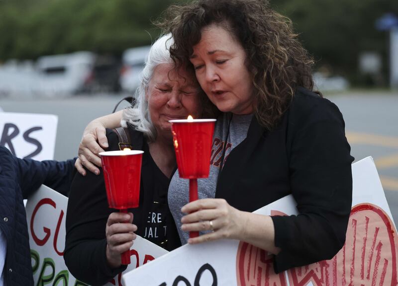 Gun-control advocates Dana Cibulski, left, and Judi Giannini attend a vigil outside the National Rifle Association headquarters in Fairfax, Virginia after the mass shooting in Uvalde, Texas. AFP
