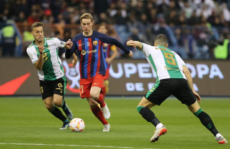 Barcelona's Frenkie de Jong in action against Real Betis' Guido Rodriguez. Reuters