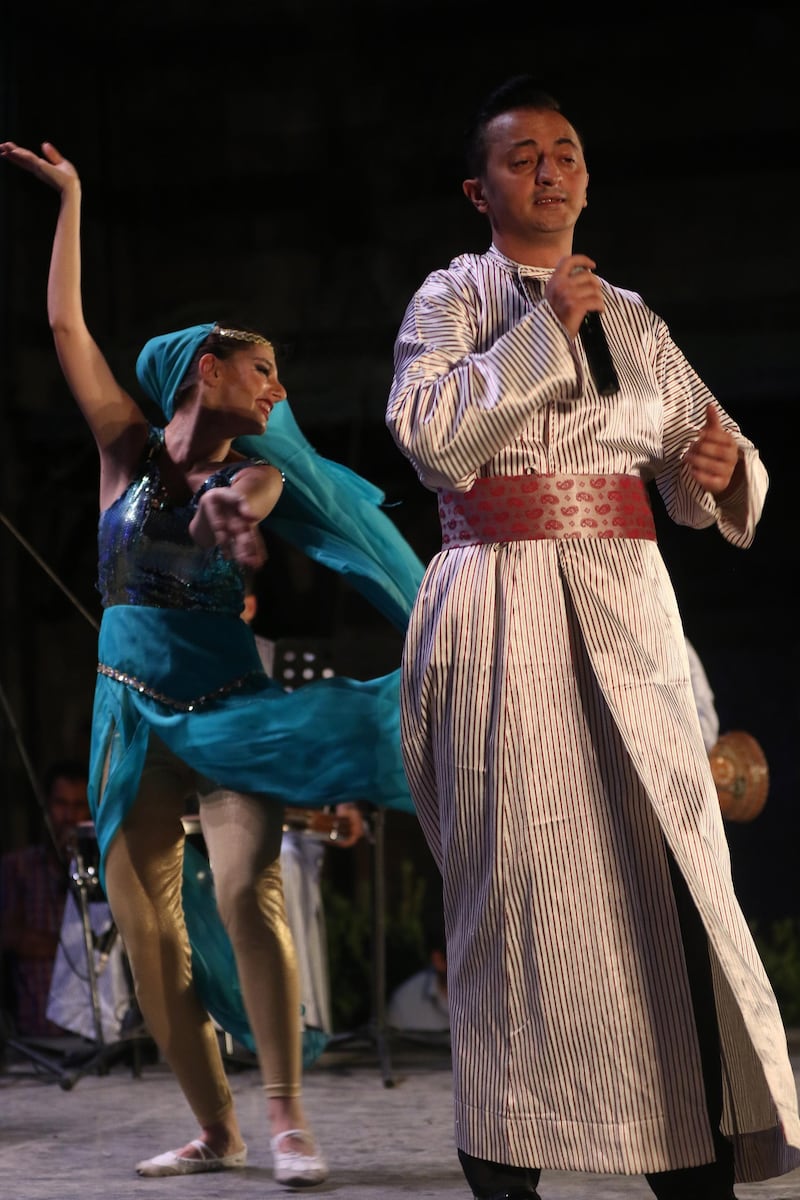 The Sultans of Tarab perform at the ancient palace of Damascus. EPA