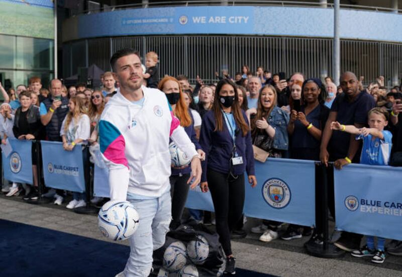 Jack Grealish with fans at the Etihad Stadium.