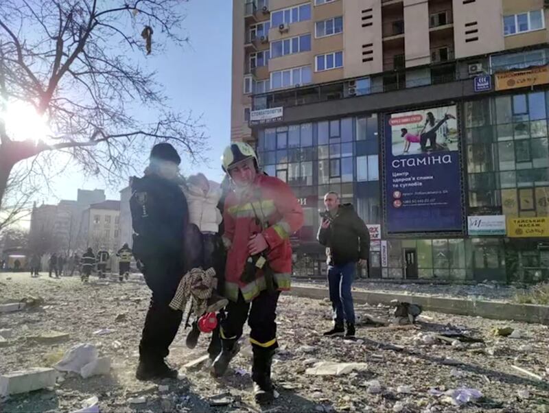 A screengrab from a video shows rescue workers carrying a person at the site of a damaged multi-storey residential building, south-west of the Ukrainian capital. Reuters
