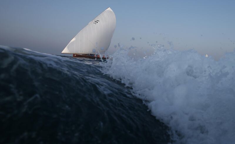 A dhow rides the waves during the Al Gaffal long-distance race. EPA