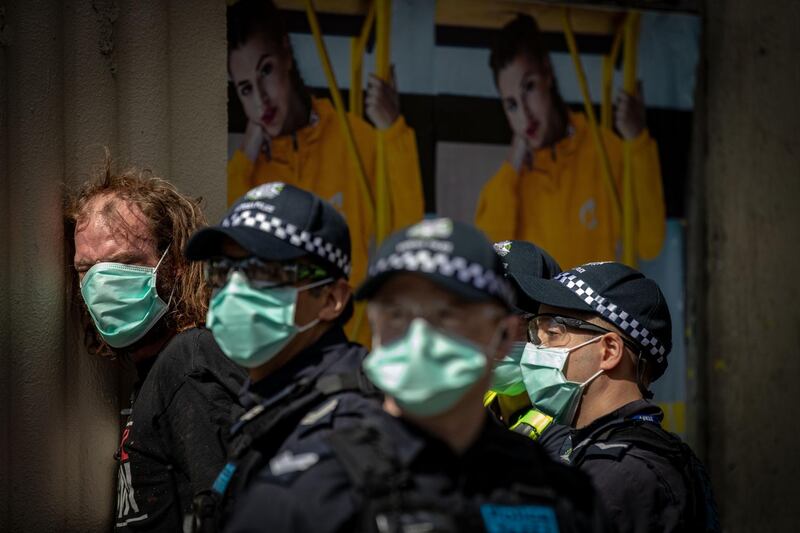 A man is detained by members of Victoria Police at the Queen Victoria Market in Melbourne, Australia. Anti-lockdown protesters organised a "freedom walk" to demonstrate against Melbourne's current Stage 4 COVID-19 restrictions. While organisers claim the gathering is legal, Victoria Police said they would be monitoring protest activity, with anyone considered to be breaching the Chief Health Officer's directives liable for a fine of $1652. Metropolitan Melbourne remains under stage 4 lockdown restrictions, with people only allowed to leave home to give or receive care, shopping for food and essential items, daily exercise and work while an overnight curfew from 8pm to 5am is also in place. The majority of retail businesses are also closed. Other Victorian regions are in stage 3 lockdown. The restrictions, which came into effect from 2 August, were introduced by the Victorian government as health authorities work to reduce community COVID-19 transmissions across the state. Getty Images