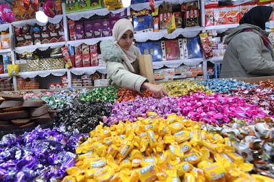 People shop for sweets in the old souq, Placette Laareb, in downtown Blida, as they prepare to celebrate the Amazigh New Year. AFP