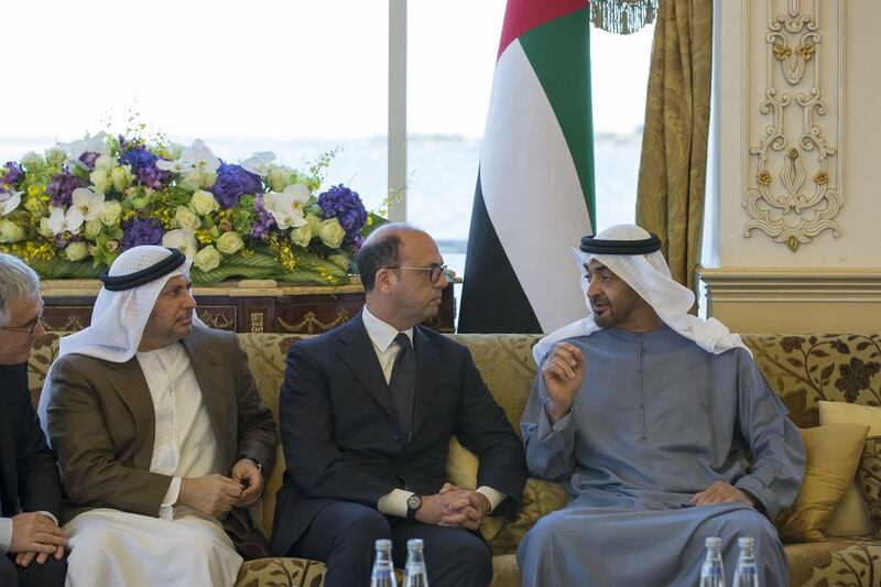 Sheikh Mohammed bin Zayed, Crown Prince of Abu Dhabi and Deputy Supreme Commander of the Armed Forces, receives Angelino Alfano Minister of Foreign Affairs and International Cooperation of Italy (C). Seen with Dr Anwar Gargash, Minister of State for Foreign Affairs, and Liborio Stellino, Ambassador of Italy to the UAE (R), during a Sea Palace barza. Mohamed Al Hammadi / Crown Prince Court — Abu Dhabi