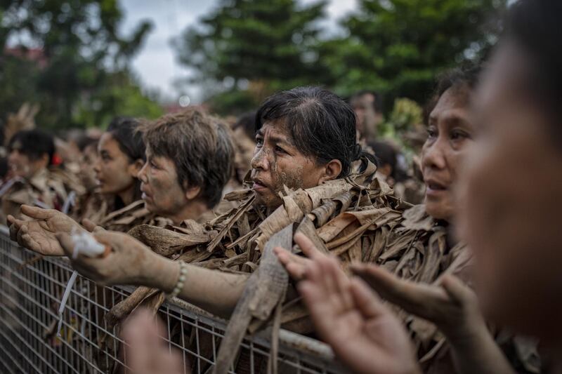 Devotees covered in mud and dried banana leaves take part in the Taong Putik ("mud people") Festival  in the village of Bibiclat in Aliaga town, Nueva Ecija province, Philippines. Each year, the residents of Bibiclat village in Aliaga town celebrate the Feast of Saint John by covering themselves in mud, dried banana leaves, vines, and twigs as part of a little-known Catholic festival. Getty Images