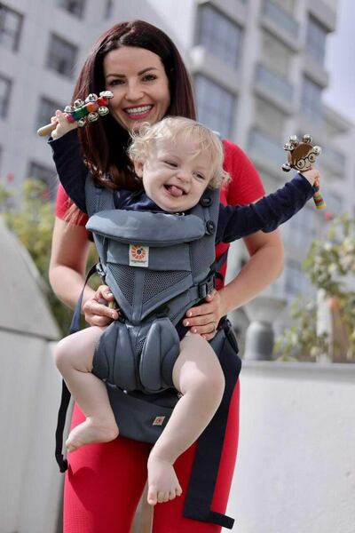 Rhian Adams and her son Samson Oliver Turton marked International Angelman Day by taking part in a beach walk with members of Help for Heroes and two other children with the disorder. Courtesy, Rhian Adams