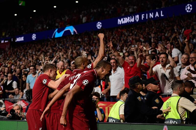 Liverpool's players celebrate Divock Origi's goal. AFP