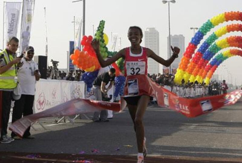 Elvan Abeylegesse, 27, of Turkey won the women's Ras Al Khaimah Half Marathon with a time of 1hr 7mins 7secs.
