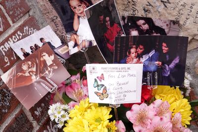 Flowers and photographs left at Graceland in tribute to Lisa Marie Presley. Reuters 