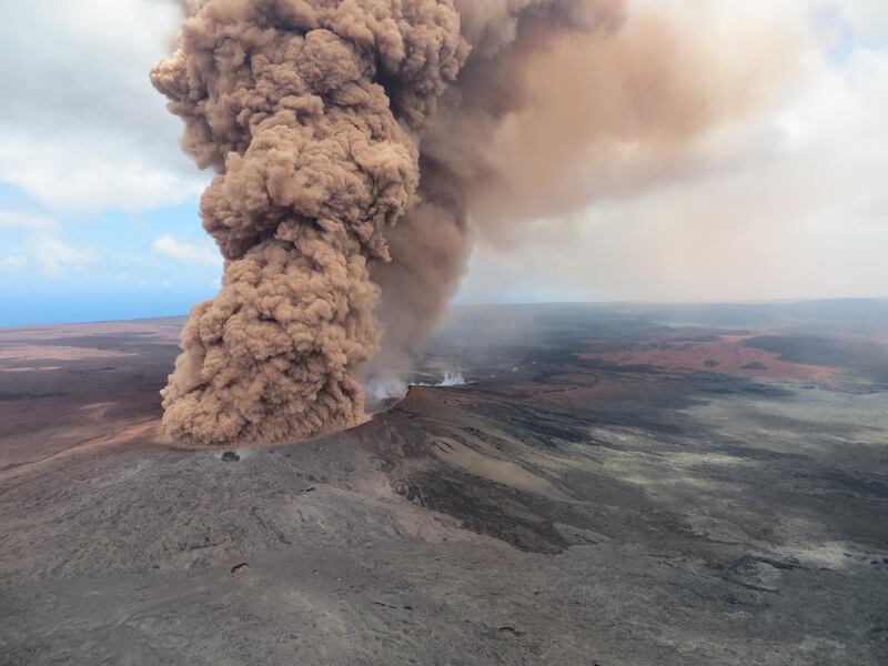 A plume of ash rising from a crater in the Mount Kilauea volcano after a magnitude 6.9 earthquake struck the area, near Pahoa, Hawaii. EPA