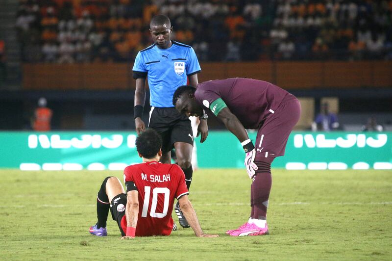 Mohamed Salah of Egypt signaled to the bench he was unable to continue. AP