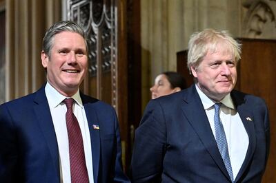 Britain's Prime Minister Boris Johnson and Labour Party opposition leader Keir Starmer walk through the Central Lobby at the Palace of Westminster in London. Reuters