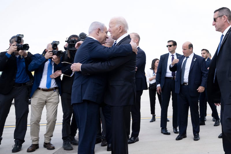 Israel Prime Minister Benjamin Netanyahu embraces US President Joe Biden at Ben Gurion airport on October 18. AFP