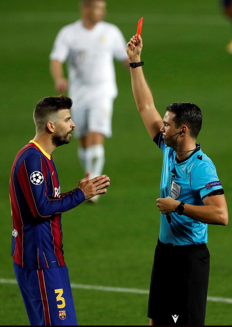 Swiss referee Sandro Schaerer shows Gerard Pique the red card. EPA