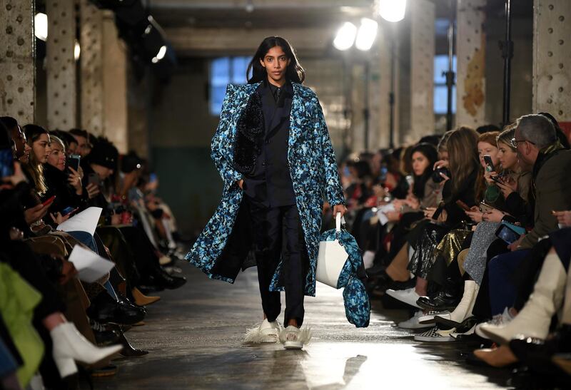 A model presents a creation by fashion house TOGA during their catwalk show for the Autumn/Winter 2020 collection on the second day of London Fashion Week in London on February 15, 2020. (Photo by DANIEL LEAL-OLIVAS / AFP)