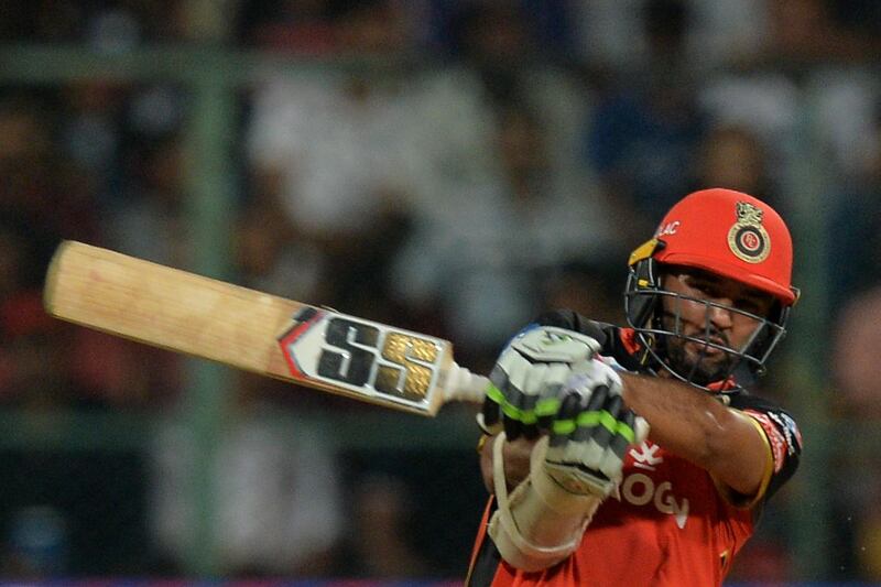 Royal Challengers Bangalore batsman Parthiv Patel plays a shot during the 2019 Indian Premier League (IPL) Twenty20 cricket match between Royal Challengers Bangalore and Kings XI Punjab at The M. Chinnaswamy Stadium in Bangalore on April 24, 2019. (Photo by Manjunath KIRAN / AFP) / ----IMAGE RESTRICTED TO EDITORIAL USE - STRICTLY NO COMMERCIAL USE-----