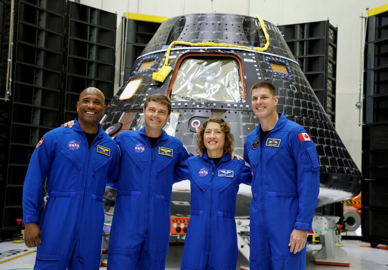 Astronauts for Nasa's Artemis 2 mission stand in front of their Orion crew capsule at the Kennedy Space Centre in Cape Canaveral, Florida. Reuters