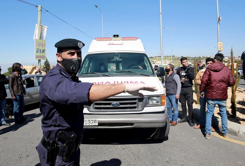 An ambulance leaves Al-Hussein Al Salt Hospital in Salt. AP Photo