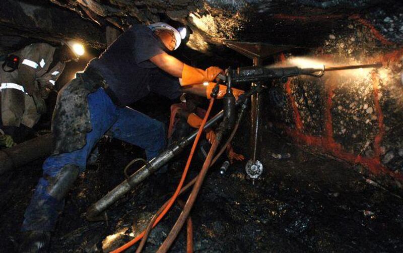 Miners drill underground at the Anglo Gold Ashanti's Mponeng gold mine in South Africa.