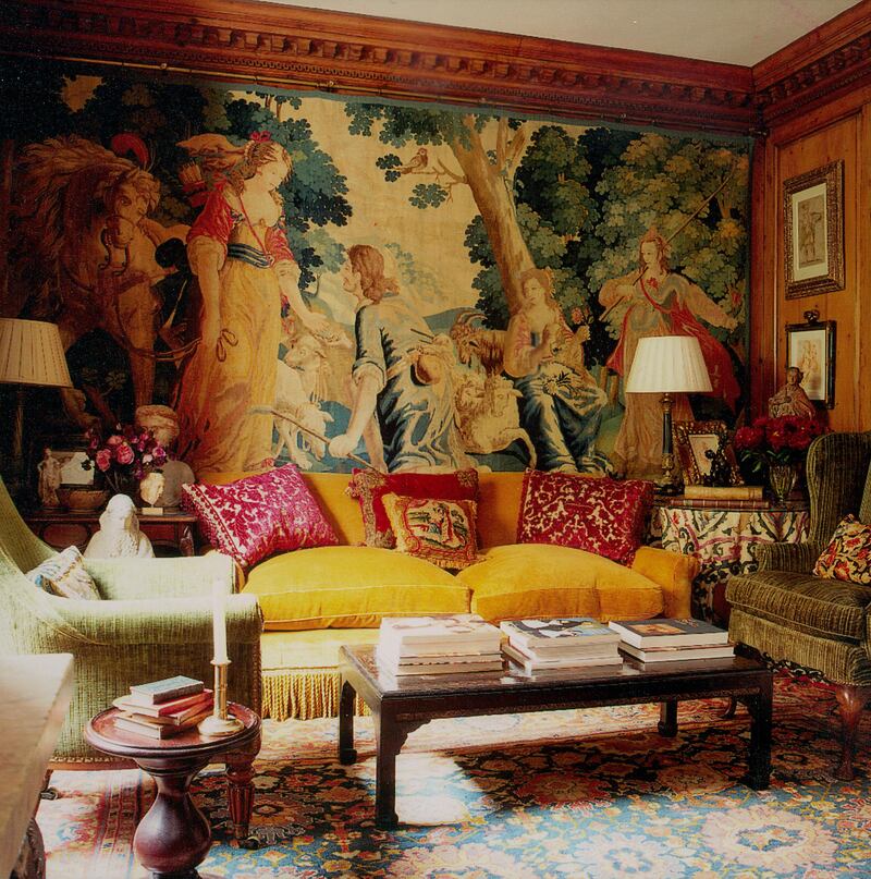ÔOne corner of the drawing room in this early Georgian London home, embodies  the facet of my work that uses textiles and pattern in a rich, harmonious mix that draws you in and ultimately gives a room its comfortable appeal. However, if you look closely there are the Alidad plain colours that create harmony, where there is pattern there is always a ÔplainÕ to balance the scheme. Here  I have used a seventeenth century Flemish tapestry, a late nineteenth-century Suzani textile, a red cut-velvet nineteenth-century Italian cushion, another made from an eighteenth century piece of needlework and a seventeenth-century fabric draped over the back of the chair. The table scene includes an Old Master drawing, an early religious apostle and a nineteenth-century bronze figure. I donÕt keep count of the many different eras and cultures in one room, I work instinctively bringing everything together as though it has evolved over time.Õ

(Photo by Simon Upton)

  *** Local Caption ***  WK19JL-HH-ALIDAD04.jpg