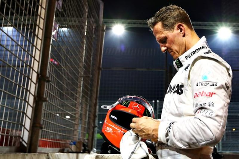 FILE - OCTOBER 04, 2012:  Michael Schumacher has announced his retirement from Formula One after a career spanning two spells during which he won a total of seven world titles, including five straight titles during his time with Ferrari. SINGAPORE - SEPTEMBER 23:  Michael Schumacher of Germany and Mercedes GP retires early after crashing into the back of Jean-Eric Vergne of France and Scuderia Toro Rosso during the Singapore Formula One Grand Prix at the Marina Bay Street Circuit on September 23, 2012 in Singapore, Singapore.  (Photo by Robert Cianflone/Getty Images)