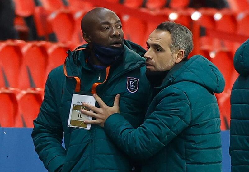 epa08871610 Pierre Achille Webo (C), assistant coach of Basaksehir, reacts during the UEFA Champions League group H soccer match between Paris Saint-Germain (PSG) and Istanbul Basaksehir in Paris, France, 08 December 2020.  EPA/IAN LANGSDON