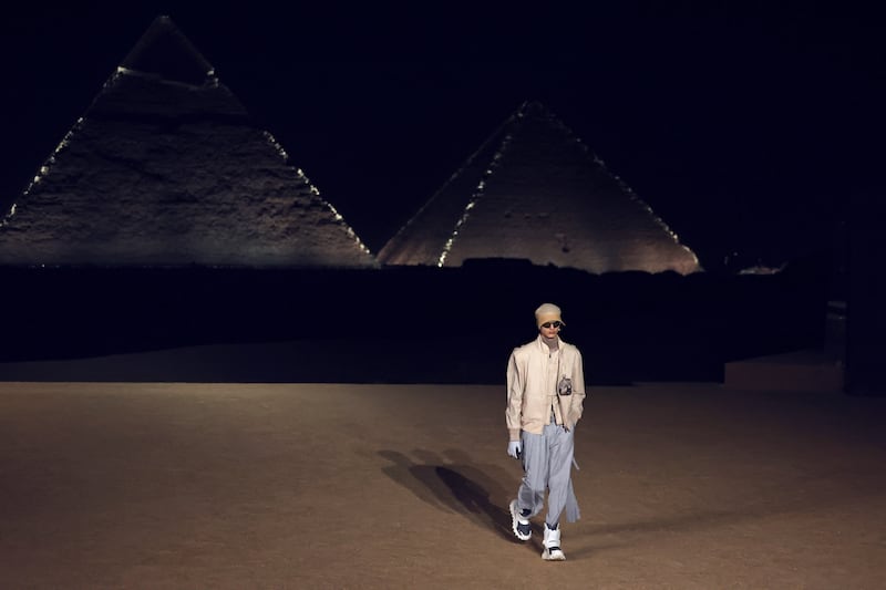 Models walk the runway during the Dior autumn 2023 menswear show on December 3, 2022 at the Pyramids of Giza in Cairo, Egypt. Getty Images