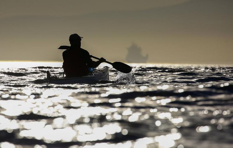 A man kayaks off the coast of Cape Town, South Africa. Nic Bothma / EPA