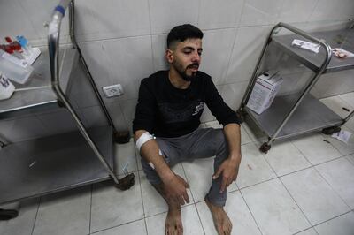 A Palestinian man who was injured in an Israeli airstrike is treated at Nasser Medical Hospital on December 17, 2023 in Khan Younis, Gaza. Getty Images 