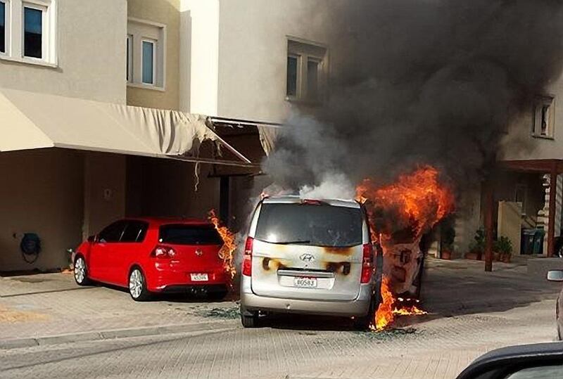 Two cars on fire in a residential area in Al Reef. Vehicles contain several flammable liquids and materials, and once a fire starts spreading it can quickly escalate, so stand well clear and call the emergency services.