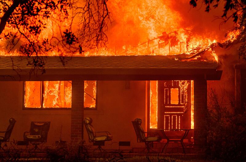 Flames engulf a home in Oroville, California. A heatwave is sending temperatures soaring resulting in red flag fire warnings. AFP