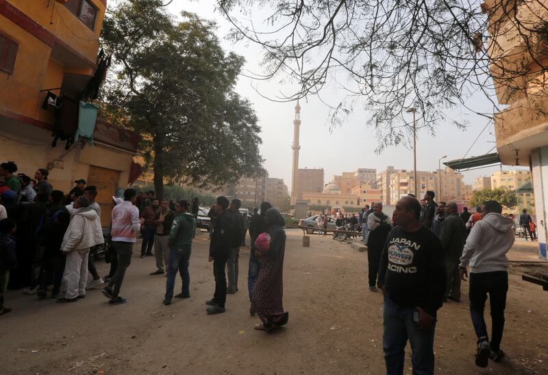 People gather at the site of attack. Amr Abdallah Dalsh / Reuters