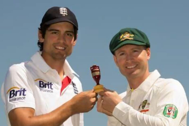 England's Alastair Cook, left, and Australia's Michael Clarke pose with the Ashes urn. Gareth Copley / Getty Images