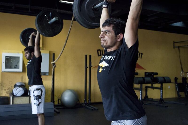 Saud Saif Al Shamsi, right, here training with his cousin Ali bin Zayed, nearly did not not make it to the Asian CrossFit regionals in South Korea because of a broken finger. Antonie Robertson / The National 