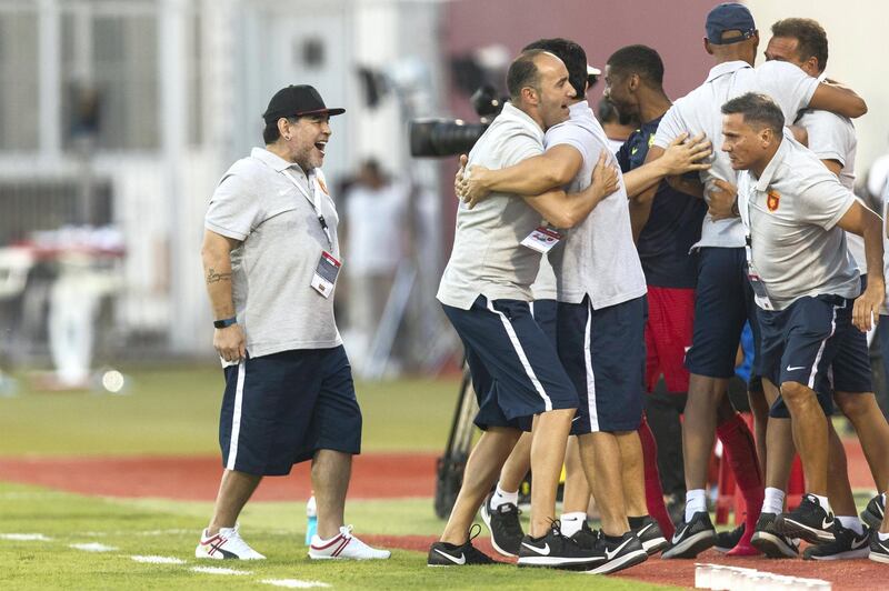 Fujairah, United Arab Emirates, November 4, 2017:    Diego Maradona, head coach of Fujairah football club, celebrates his team scoring against Al Orouda during their UAE first division regular season match at the Fujairah stadium in Fujairah on November 4, 2017. Christopher Pike / The National

Reporter: John McAuley
Section: Sport