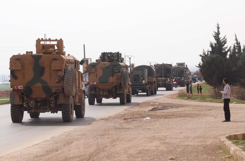 A Turkish military convoy drives near the Syrian town of Kefraya on the highway linking the northwestern Syrian province of Idlib to the Bab al-Hawa border crossing with Turkey, on March 10, 2020. The situation in Syria's war-ravaged northwest has been relativly calm since late last week, following a Russian-Turkish ceasefire deal reached on March 5th.
 / AFP / Ahmad al-ATRASH
