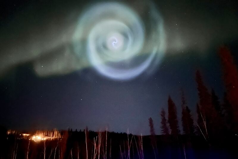 A spiral resembling a galaxy in the sky in Alaska on April 15, 2023. It formed when a SpaceX rocket dumped excess fuel. AP