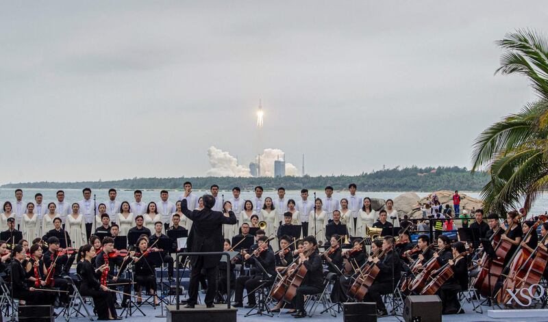 A band plays as the Long March 5B rocket, which carries China's Tianhe space station core module, lifts off from the Wenchang Spacecraft Launch Centre, in southern China's Hainan province. AFP