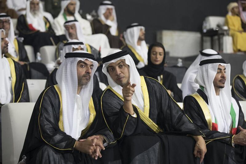 Sheikh Hamed bin Zayed, Chairman of the Crown Prince Court of Abu Dhabi and Abu Dhabi Executive Council Member, left, Sheikh Mansour bin Zayed, Deputy Prime Minister and Minister of Presidential Affairs, second left, and Sheikh Issa bin Zayed, right, attend the 45th UAE National Day celebrations. Mohamed Al Hammadi / Crown Prince Court — Abu Dhabi