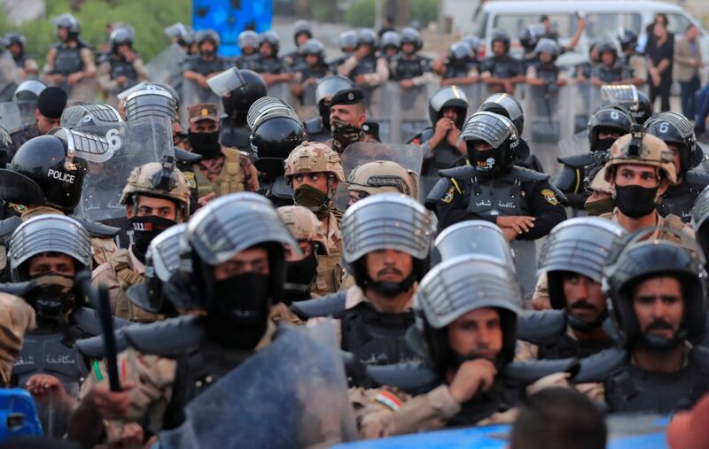 Security forces stand guard near the old Turkish embassy building in Dohuk. Reuters