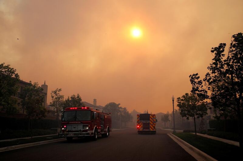 Fire trucks arrive as the Silverado Fire approaches, near Irvine, California, US, on October 26, 2020. REUTERS