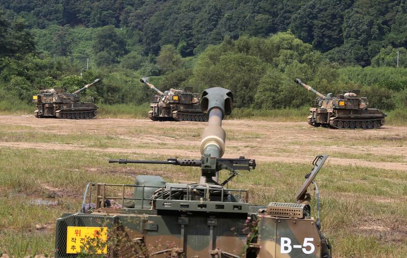 
                  South Korean army's K-55 self-propelled howitzers are at positions during a military exercise in Paju, South Korea, near the border with North Korea, Monday, Sept. 4, 2017. Following U.S. warnings to North Korea of a "massive military response," South Korea's military on Monday fired missiles into the sea to simulate an attack on the North's main nuclear test site a day after Pyongyang detonated its largest ever nuclear test explosion. (AP Photo/Ahn Young-joon)
               