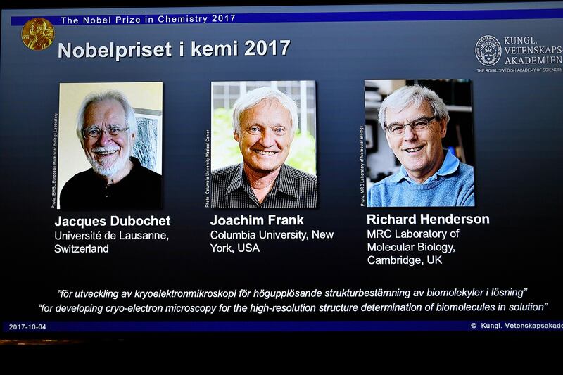 epa06243649 A screen shows (L-R) scientists Jacques Dubochet, Joachim Frank and Richard Henderson who were award the Nobel Prize in Chemistry 2017, during a press conference at the Royal Academy of Sciences in Stockholm, Sweden, 04 October 2017. The Karolinska Institute of Stockholm, Sweden, announced 04 October 2017, that scientists Jacques Dubochet, University of Lausanne, Switzerland, Joachim Frank, Columbia University, New York, USA and Richard Henderson, MRC Laboratory of Molecular Biology, Cambridge, Britain were awarded with the 2017 Nobel Prize in Chemistry for 'developing cryo-electron microscopy for the high-resolution structure determination of biomolecules in solution'.  EPA/Claudio Bresciani SWEDEN OUT