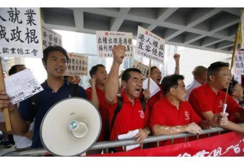 Workers protest outside the High Court in Hong Kong where Evangeline Vallejos' case was heard.