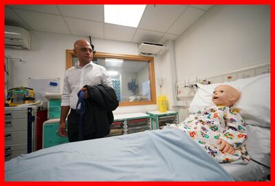Former health secretary Sajid Javid looks at a simulated patient at Great Ormond Street Hospital while announcing a new digital health plan in June