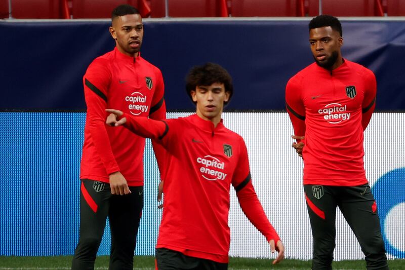 Atletico Madrid's Renan Lodi, Joao Felix and Thomas Lemar attend a training session. EPA